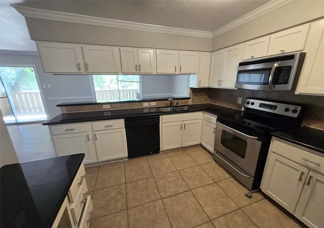 Photo 1 of Condo for sale at 5661 Birchmont Dr #E, Houston, TX 77091 | MLS# 71789835 | Listing updated on 2026-09-23