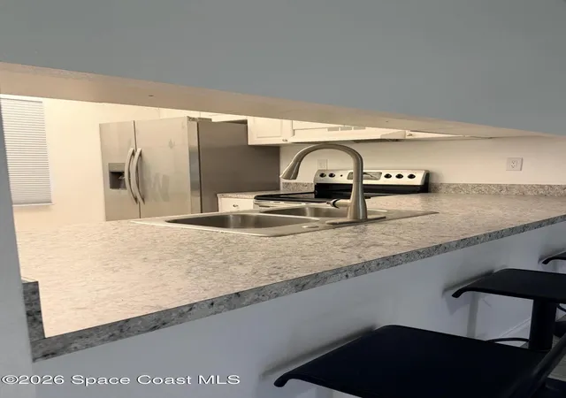 Photo 2 of Condo for sale at 2727 N Wickham Rd #103-5, Melbourne, FL 32935 | MLS# 1086795 | Listing updated on 2026-09-05