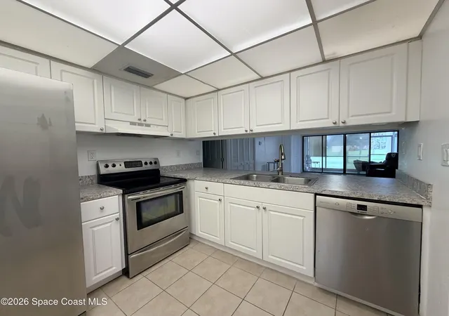 Photo 3 of Condo for sale at 2727 N Wickham Rd #103-5, Melbourne, FL 32935 | MLS# 1086795 | Listing updated on 2026-09-05