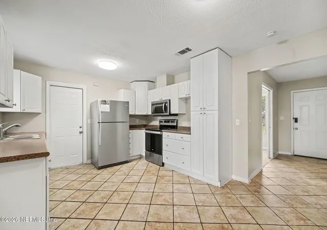 Photo 3 of Single family home for sale at 8232 Frost St N, Jacksonville, FL 32221 | MLS# 2166066 | Listing updated on 2026-09-23
