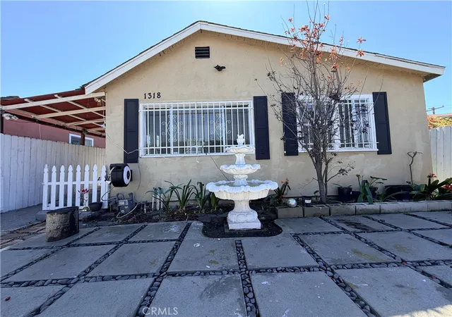 Photo 1 of Sale Pending at 1318 E 100th Street, Los Angeles, CA 90002 | MLS# OC26030159 | Listing updated on 2026-09-14