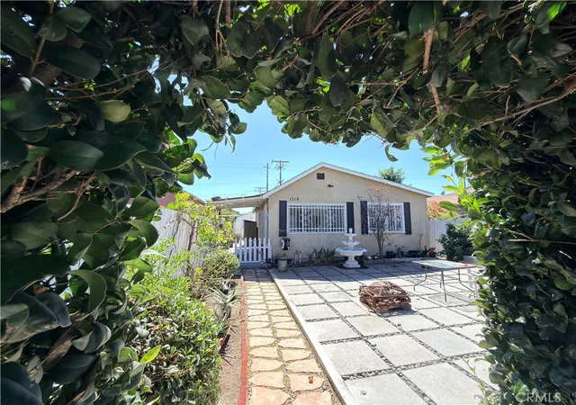 Photo 2 of Sale Pending at 1318 E 100th Street, Los Angeles, CA 90002 | MLS# OC26030159 | Listing updated on 2026-09-14