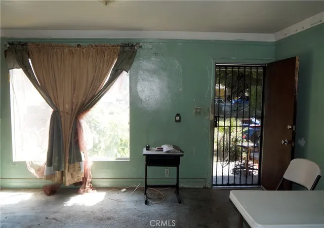 Photo 3 of Single family home for sale at 937 E 91st Street, Los Angeles, CA 90002 | MLS# SB26040402 | Listing updated on 2026-09-14
