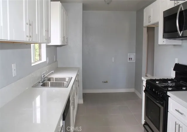 Photo 3 of Multi family home for sale at 1009 E Stockton Ave, Compton, CA 90221 | MLS# OC26064278 | Listing updated on 2026-09-14