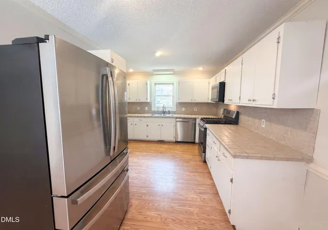 Photo 3 of Single family home for sale at 102 Carmel Ct, Cary, NC 27511 | MLS# 10175699 | Listing updated on 2026-09-20