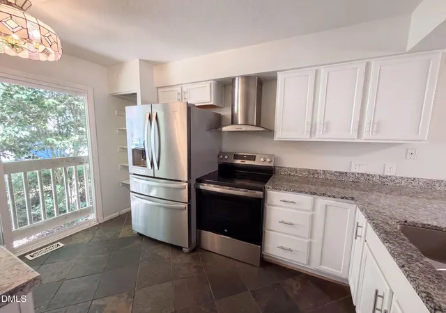 Photo 2 of Townhouse for sale at 704 Green Ridge Dr, Raleigh, NC 27609 | MLS# 10191385 | Listing updated on 2026-10-08