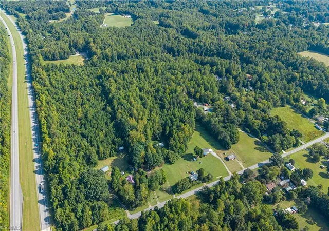Photo 3 of Single family home for sale at 1056 Sutton Rd, Greensboro, NC 27406 | MLS# 1235826 | Listing updated on 2026-10-01