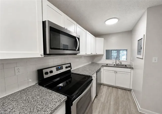 Photo 3 of Single family home for sale at 301 Village Ln #C, Greensboro, NC 27409 | MLS# 1234657 | Listing updated on 2026-09-04