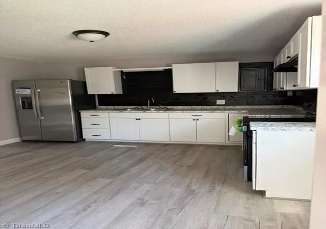 Photo 3 of Single family home for sale at 1009 Poplar St, Reidsville, NC 27320 | MLS# 1236124 | Listing updated on 2026-09-18
