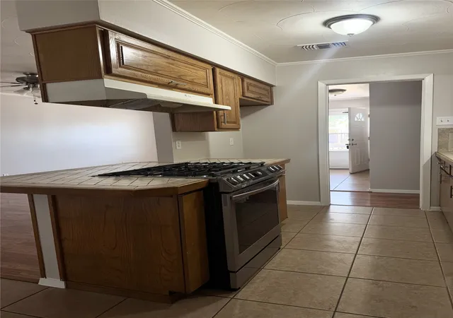 Photo 4 of Single family home for sale at 1305 Glenville Dr, Garland, TX 75042 | MLS# 21298236 | Listing updated on 2026-09-11