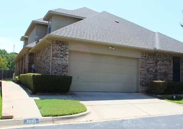 Photo 1 of Townhouse for sale at 1230 Woodland Park Dr, Hurst, TX 76053 | MLS# 21325202 | Listing updated on 2026-09-09