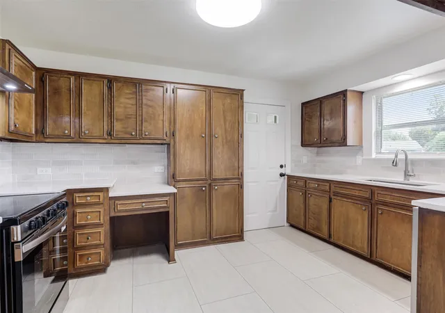 Photo 4 of Single family home for sale at 1502 Resistol Rd, Garland, TX 75042 | MLS# 21328407 | Listing updated on 2026-09-12