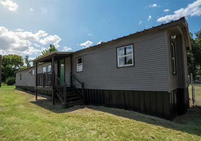 Photo 2 of Manufactured home for sale at 7058 Cimmaron Trl, Weatherford, TX 76087 | MLS# 21330418 | Listing updated on 2026-07-31