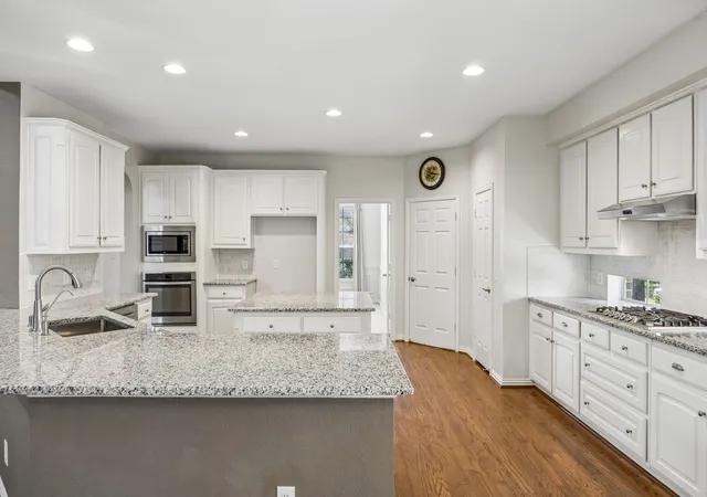 Photo 2 of Single family home for sale at 122 Woodland Cvs, Coppell, TX 75019 | MLS# 21333035 | Listing updated on 2026-10-07
