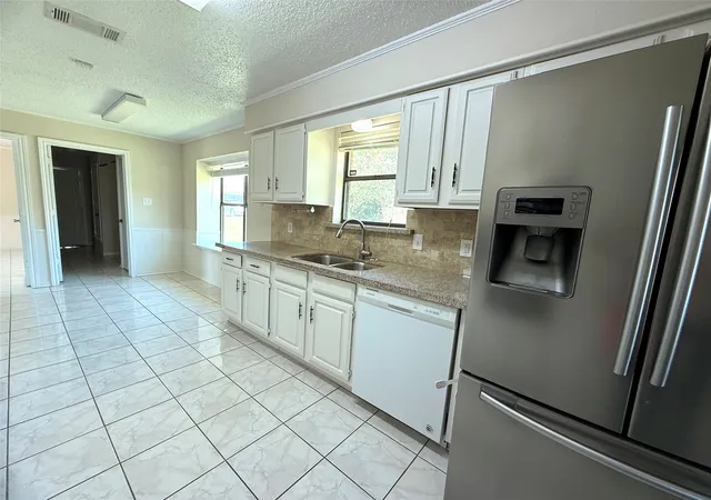 Photo 4 of Single family home for sale at 1603 E Peters Colony Rd, Carrollton, TX 75007 | MLS# 21344865 | Listing updated on 2026-07-30