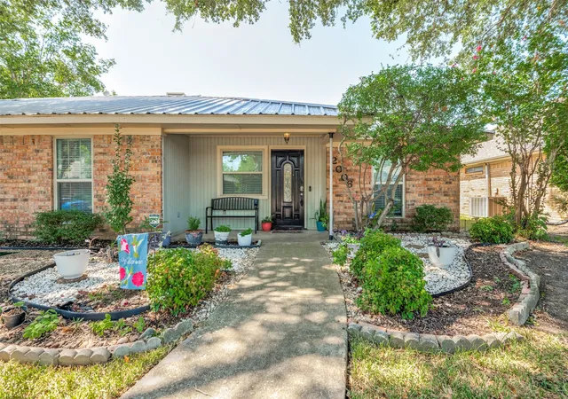 Photo 2 of Single family home for sale at 2006 E Branch Hollow Dr, Carrollton, TX 75007 | MLS# 21357234 | Listing updated on 2026-09-24