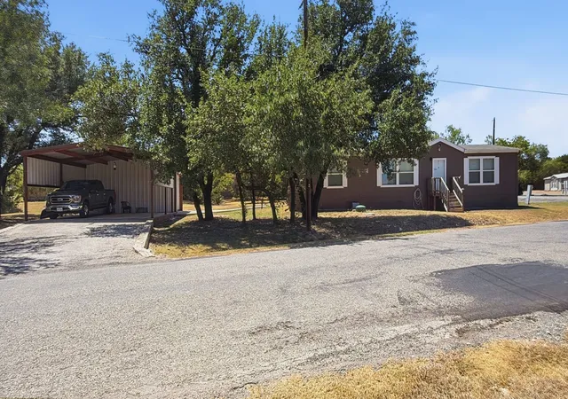 Photo 1 of Manufactured home for sale at 801 Pecos River Dr, Granbury, TX 76048 | MLS# 21360663 | Listing updated on 2026-09-11