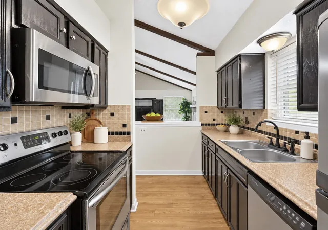 Photo 4 of Townhouse for sale at 4915 Rollingwood Ct, Garland, TX 75043 | MLS# 21411773 | Listing updated on 2026-10-22