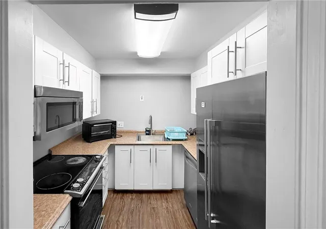 Listing Photo 1 - Condo for sale in building located at 475 Mount Vernon Hwy Ne, Sandy Springs, GA 30328 - Unit #A100
