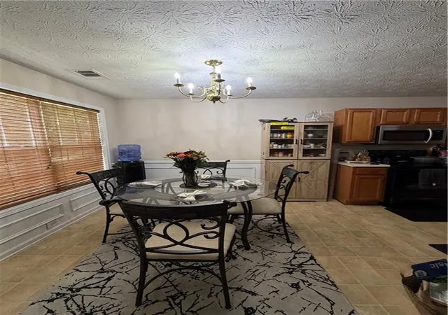 Photo 4 of Single family home for sale at 667 Lakes Cir, Lithonia, GA 30058 | MLS# 7839876 | Listing updated on 2026-09-25