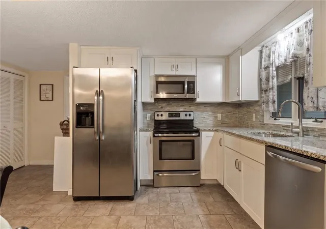 Photo 3 of Multi family home for sale at 76 Dewey St, Woonsocket, RI 02895 | MLS# 1421074 | Listing updated on 2026-10-06