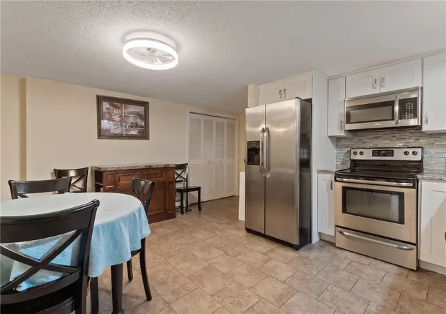 Photo 4 of Multi family home for sale at 76 Dewey St, Woonsocket, RI 02895 | MLS# 1421074 | Listing updated on 2026-10-06