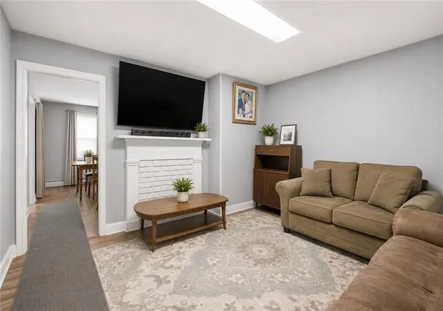 Photo 3 of Multi family home for sale at 409 Rathbun St, Woonsocket, RI 02895 | MLS# 1421531 | Listing updated on 2026-09-27
