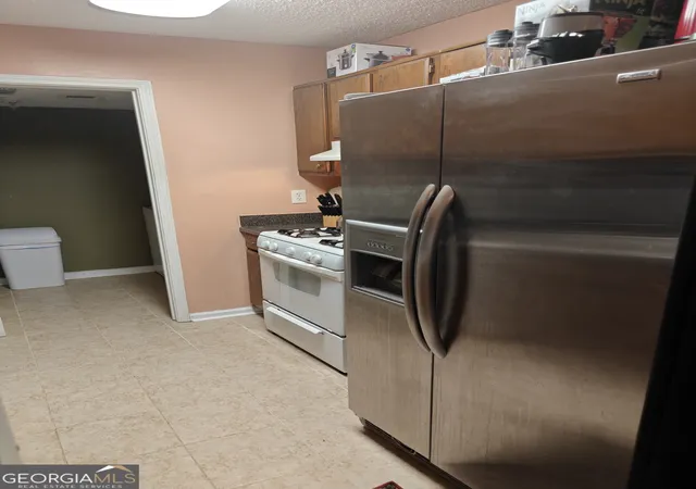 Photo 3 of Townhouse for sale at 887 Brandy Oaks Ln, Stone Mountain, GA 30088 | MLS# 10851241 | Listing updated on 2026-10-06