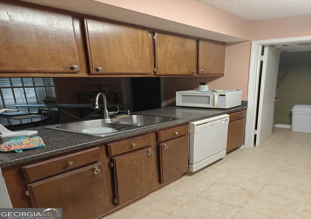 Photo 3 of Townhouse for sale at 887 Brandy Oaks Ln, Stone Mountain, GA 30088 | MLS# 10851241 | Listing updated on 2026-10-06