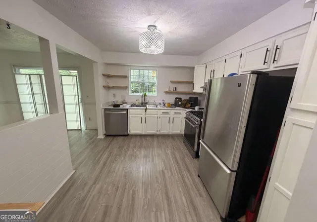 Photo 3 of Single family home for sale at 6161 Saint Charles Ct, Lithonia, GA 30058 | MLS# 10844615 | Listing updated on 2026-09-25