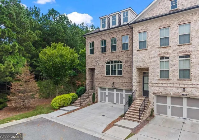 Photo 1 of Townhouse for sale at 1402 Wisteria Wall Dr, Suwanee, GA 30024 | MLS# 10852308 | Listing updated on 2026-10-08