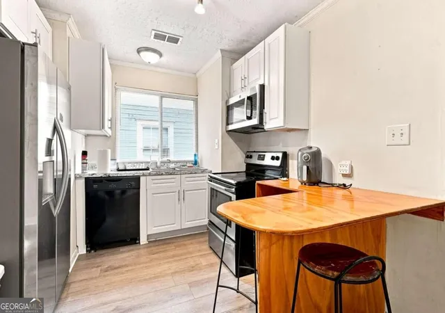Photo 2 of Sale Pending at 1071 Center St NW, Atlanta, GA 30318 | MLS# 10839599 | Listing updated on 2026-09-14