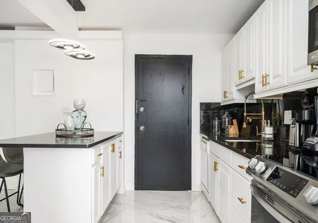 Listing Photo 1 - Condo for sale in building located at 215 Piedmont Ave Ne, Atlanta, GA 30308 - Unit #707