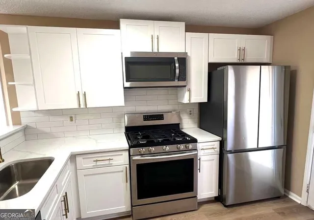 Photo 3 of Townhouse for sale at 7941 Creekstone Way, Riverdale, GA 30274 | MLS# 10840488 | Listing updated on 2026-09-18