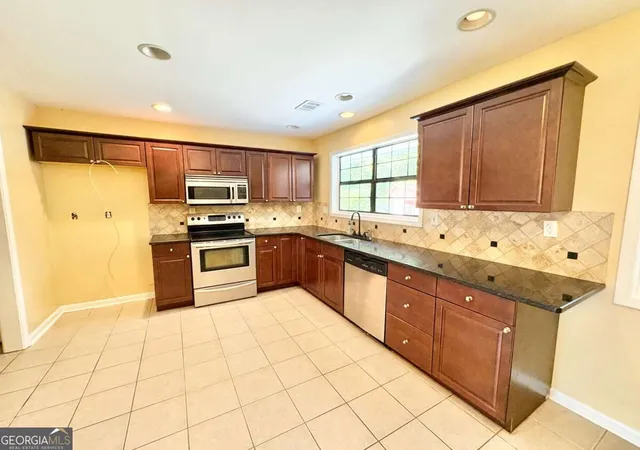 Photo 4 of Single family home for sale at 1398 Fairfield Dr SW, Lilburn, GA 30047 | MLS# 10840371 | Listing updated on 2026-09-18