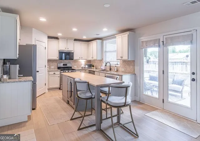 Photo 2 of Single family home for sale at 5703 Shore Isle Ct, Flowery Branch, GA 30542 | MLS# 10850614 | Listing updated on 2026-10-06