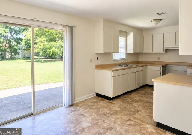 Photo 3 of Multi family home for sale at 303 Utah Ave, Warner Robins, GA 31093 | MLS# 10850878 | Listing updated on 2026-09-26