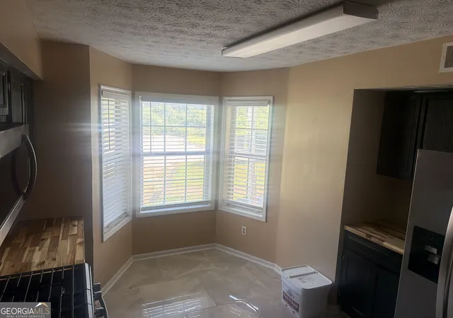 Listing Photo 1 - Condo for sale in building located at 9472 Cypress Ln, Jonesboro, GA 30238