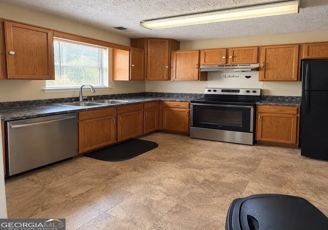 Photo 3 of Townhouse for sale at 5896 Trent Walk Dr, Lithonia, GA 30038 | MLS# 10843272 | Listing updated on 2026-09-24