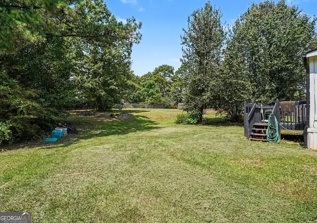 Photo 2 of Single family home for sale at 915 Steele Dr, Hampton, GA 30228 | MLS# 10840372 | Listing updated on 2026-09-26