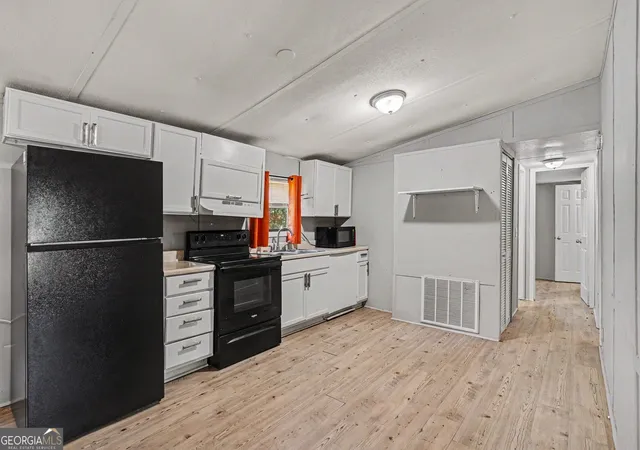 Photo 3 of Single family home for sale at 915 Steele Dr, Hampton, GA 30228 | MLS# 10840372 | Listing updated on 2026-09-18