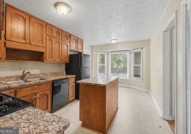 Photo 4 of Single family home for sale at 1465 Lake Lucerne Rd SW, Lilburn, GA 30047 | MLS# 10836618 | Listing updated on 2026-09-18