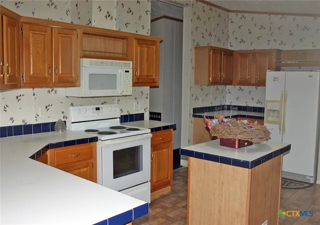 Photo 4 of Manufactured home for sale at 12000 Mustang Mesa Dr, Buda, TX 78610 | MLS# 614389 | Listing updated on 2026-08-04