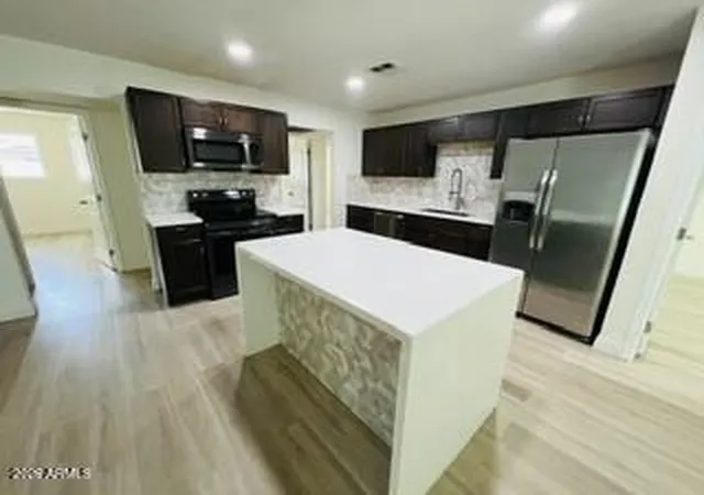 Photo 3 of Single family home for sale at 6930 W Lewis Ave, Phoenix, AZ 85035 | MLS# 7075447 | Listing updated on 2026-09-04
