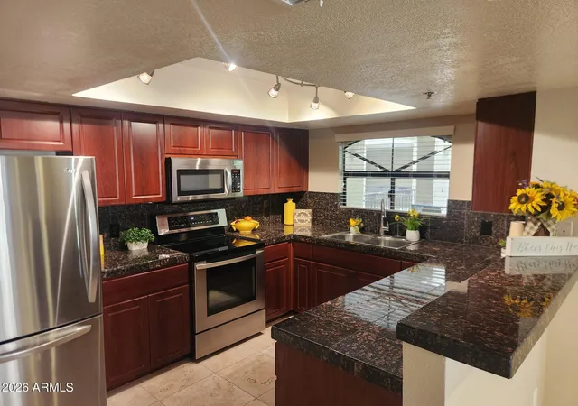 Listing Photo 1 - Condo for sale in building located at 5104 N 32Nd St, Phoenix, AZ 85018 - Unit #208