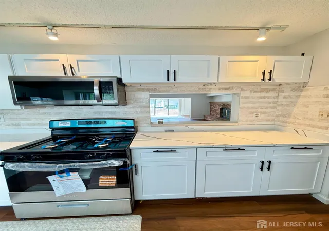 Photo 3 of Townhouse for sale at 13 Dartmouth Way, North Brunswick, NJ 08902 | MLS# 2704100R | Listing updated on 2026-09-18