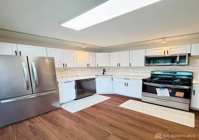 Photo 3 of Townhouse for sale at 13 Dartmouth Way, North Brunswick, NJ 08902 | MLS# 2704100R | Listing updated on 2026-09-18
