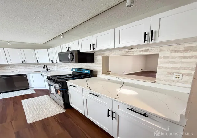 Photo 4 of Townhouse for sale at 13 Dartmouth Way, North Brunswick, NJ 08902 | MLS# 2704100R | Listing updated on 2026-09-18