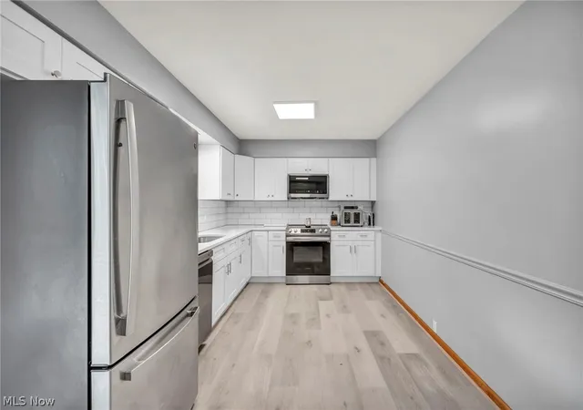 Photo 3 of Single family home for sale at 8560 Glennridge Ave Nw, Clinton, OH 44216 | MLS# 5214989 | Listing updated on 2026-10-01