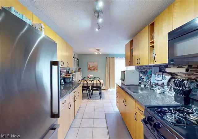 Photo 3 of Condo for sale at 1390 Golden Gate Blvd #E204, Mayfield Heights, OH 44124 | MLS# 5238912 | Listing updated on 2026-09-29